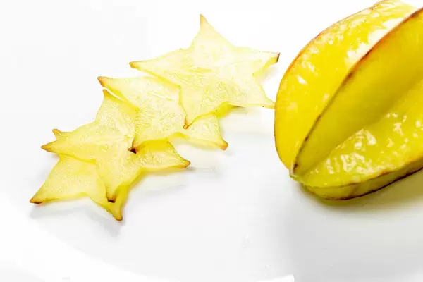 Ripe star fruit with slices on white background - carambola (Flip 2019)