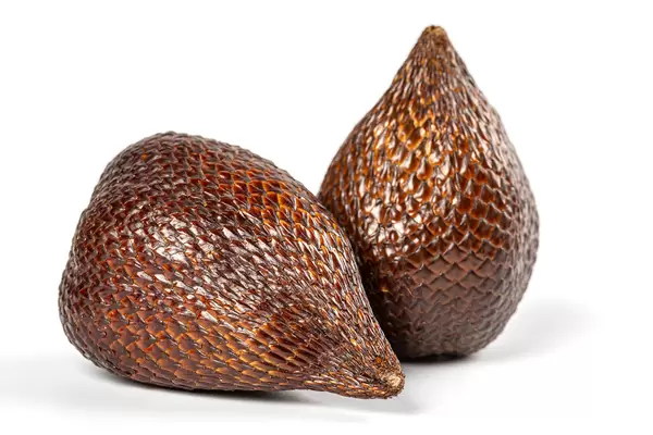 Ripe whole snake fruit on white