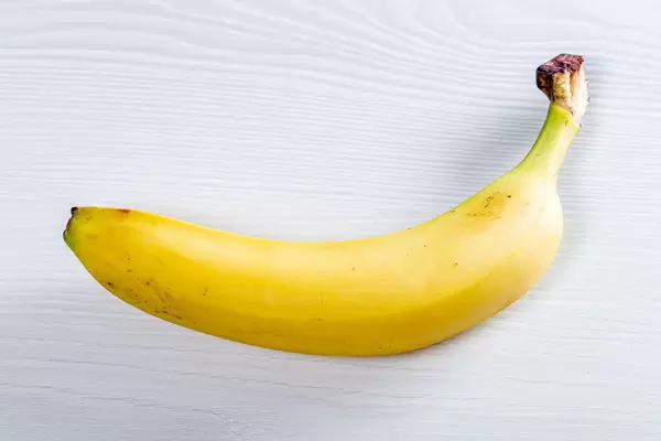 Ripe yellow banana on white background (Flip 2019)