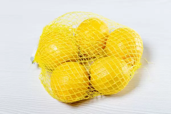 Ripe yellow lemons Packed in mesh (Flip 2019)