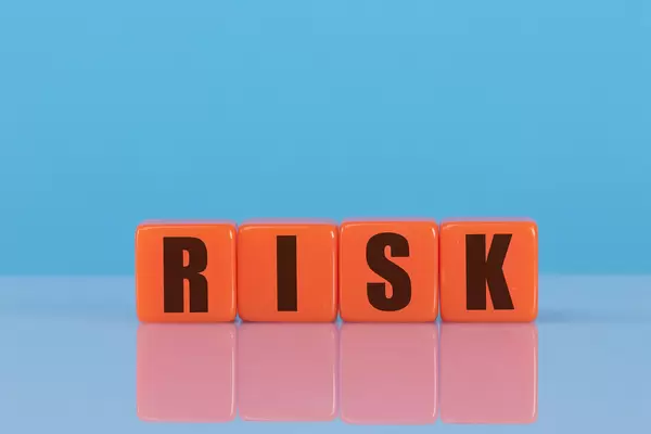 Risk text on orange cubes