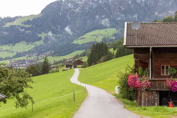 Road going through the Alpbach valley to the surrounding mountains in Tyrol, Austria