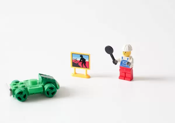 Road worker stopping the car