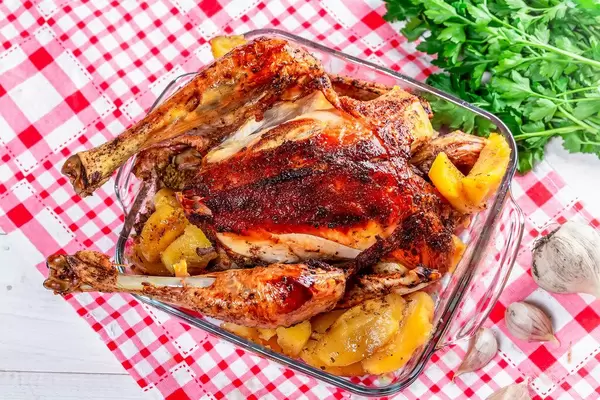 Roasted chicken on table, top view (Flip 2019)