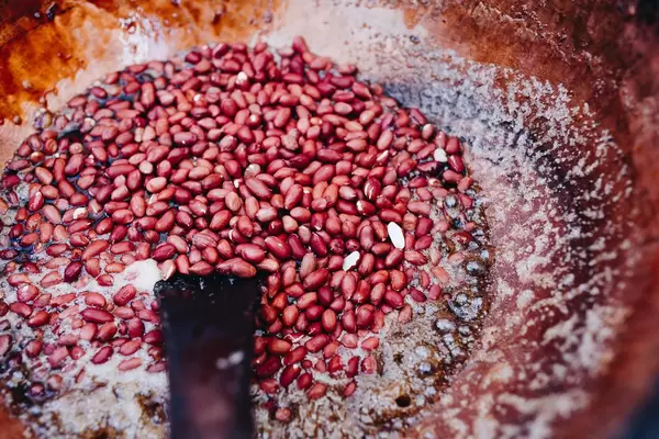 Roasted redskin peanuts in a bowl.
