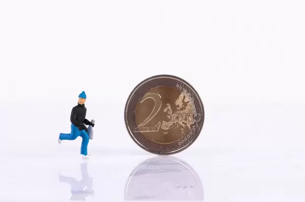 Robber and 2 Euro coin on white background