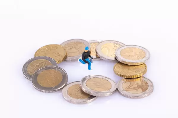 Robber with coins on white background