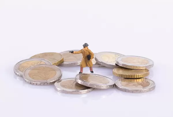 Robber with gun and coins on white