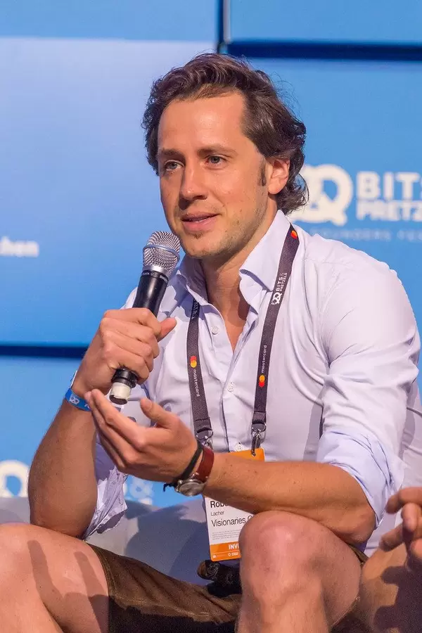 Robert Lacher, Founding Partner at Visionaries Club and jury member during the startup pitch finals at founders' event Bits and Pretzels 2019