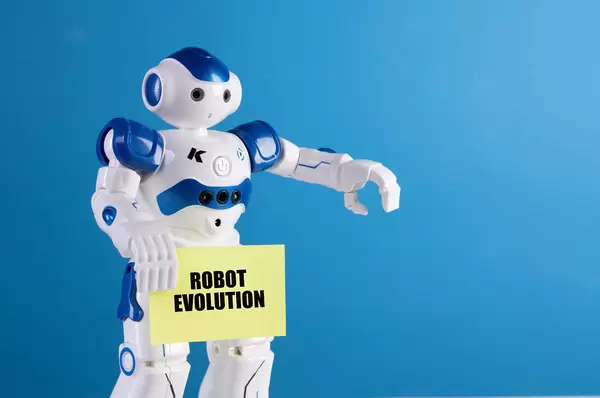 Robot holding a sing with Robot Evolution text