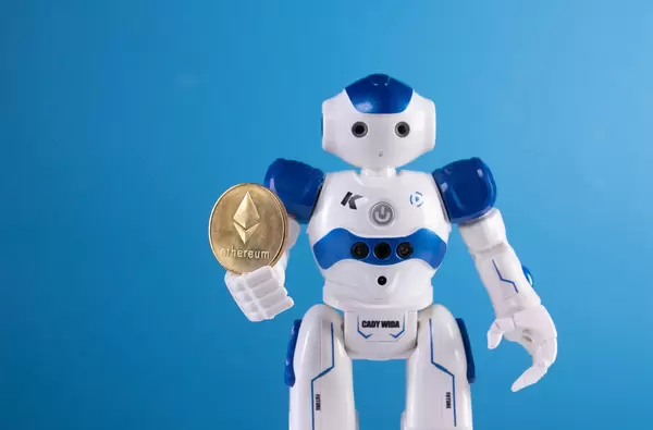 Robot holding golden Ethereum coin
