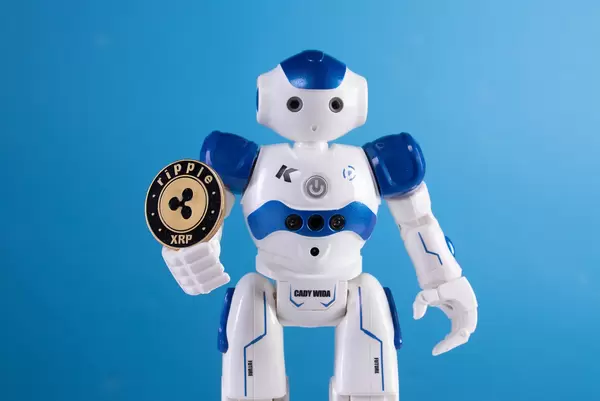 Robot holding Ripple coin