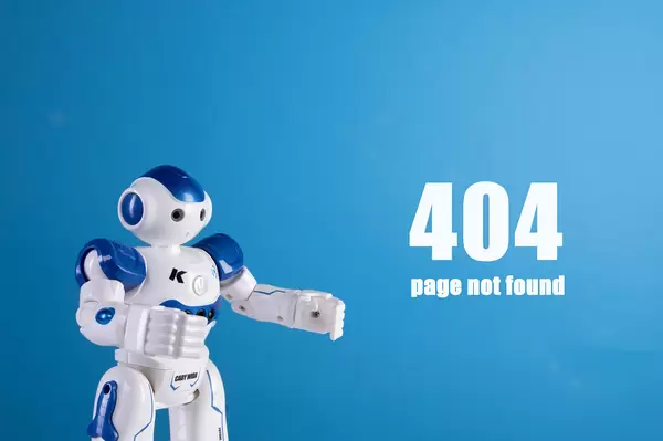 Robot with 404 page not found text on a blue background