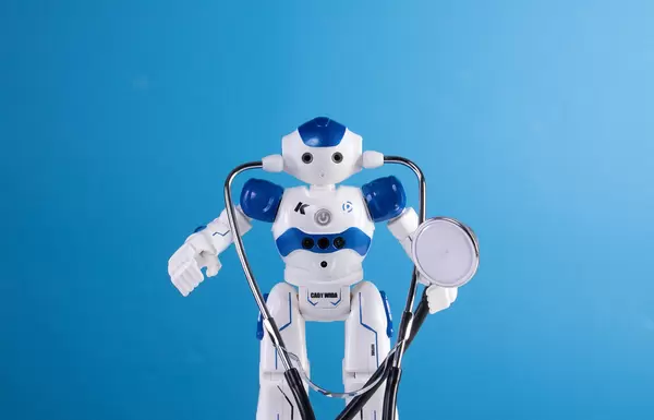Robot with stethoscope on blue background