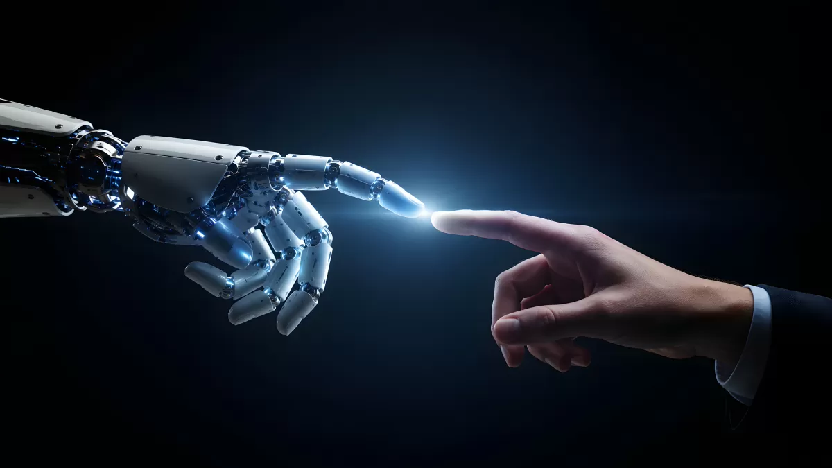 Roboterhand berührt menschlichen Finger – KI trifft Mensch