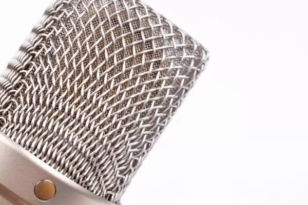 Rode NT1A condenser microphone head above white background