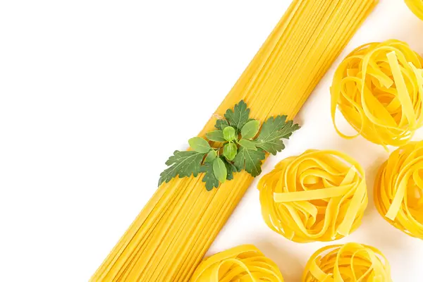 Rolled raw tagliatelle and spaghetti, italian pasta on white background