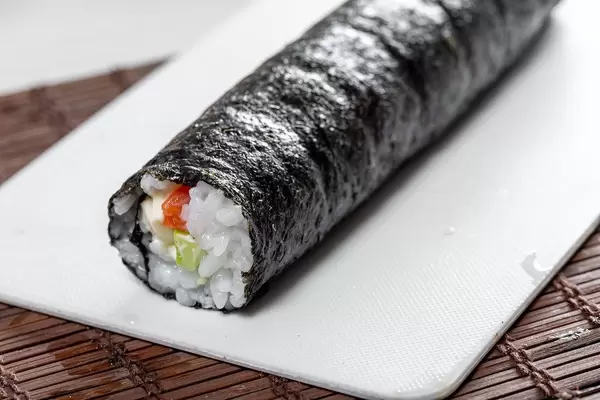 Rolling sushi maki. Preparation of Maki rolls with salmon (Flip 2019)