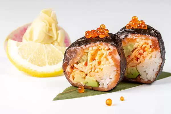 Rolls with nori, salmon, crab, rice, avocado, tobik caviar, salmon caviar and micro-greens (Flip 2019)