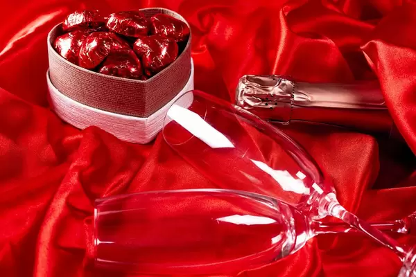 Romantic background with champagne and chocolates