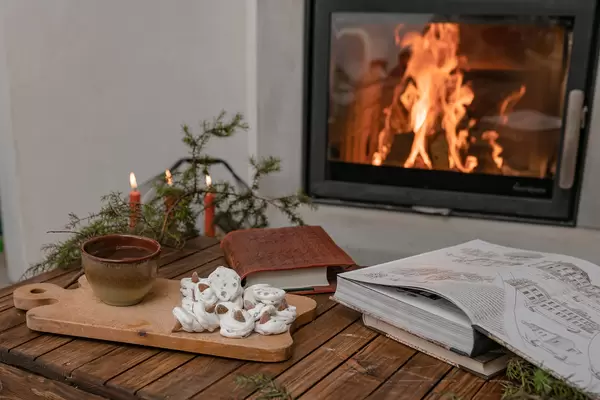 Romantic Winter Hygge Mood With Fireplace And Tea