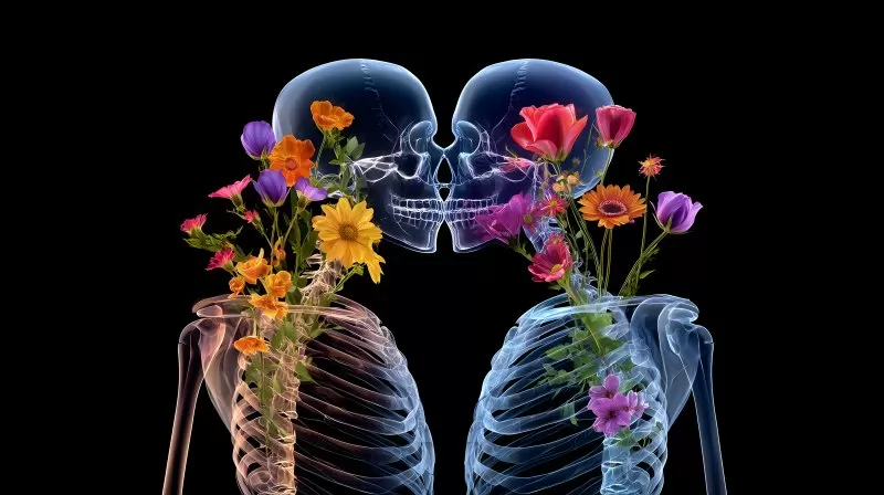 Romantic x-ray skeletons kissing with colorful flowers