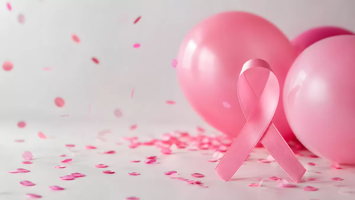 Rosa Schleife mit Luftballons und Konfetti auf hellem Hintergrund