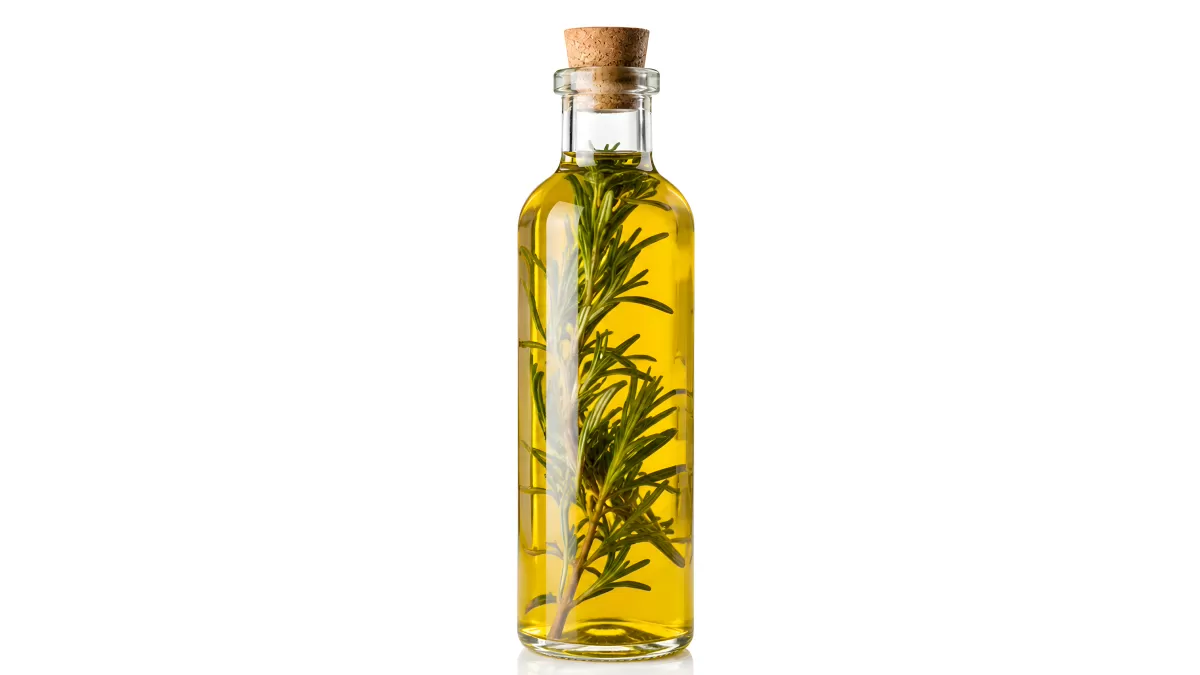 Rosmarin-Olivenöl in eleganter Glasflasche mit Korken