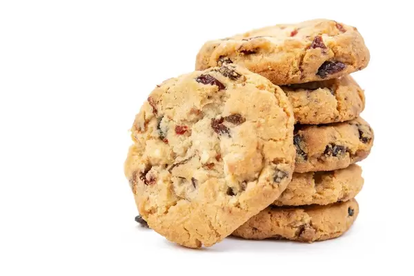 Round Biscuits with Raisins isolated above white background