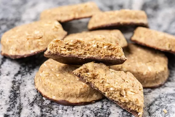 Round Chocolate Integral Biscuits on grey marble