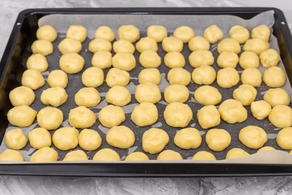Round Cookies in the baking tray prepared for baking