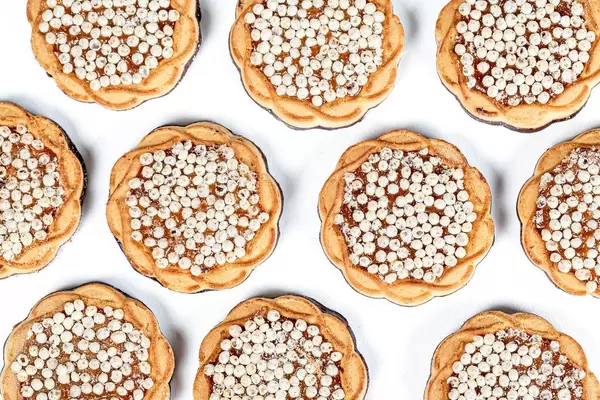 Round cookies with chocolate, condensed milk and corn balls, top view