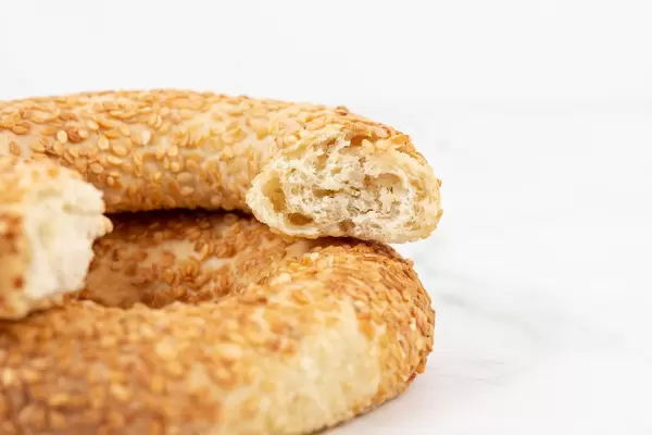 Round Pastry with sesame above white background (Flip 2019)