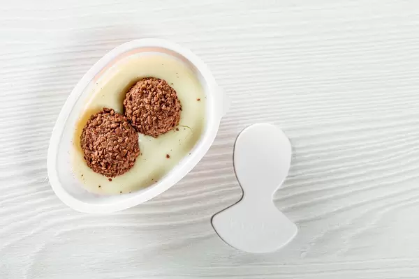 Round waffle balls with chocolate cream in kinder joy half