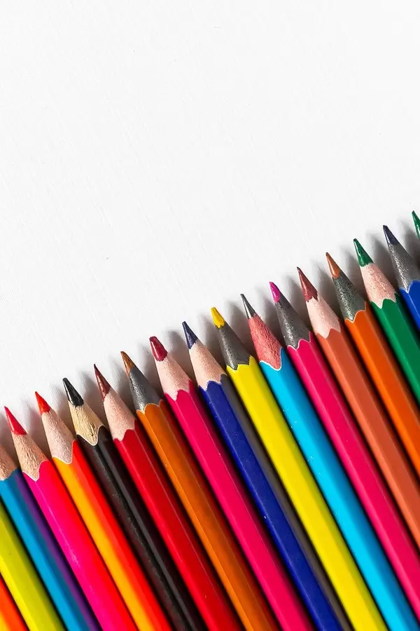 Row of colored pencils on white background (Flip 2019)