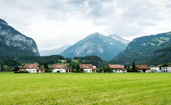 Row of white Swiss houses in the Alps (Flip 2019)