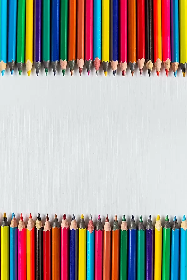 Rows of color pencils on a blank white paper (Flip 2019)