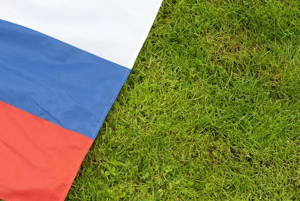 Russian flag on the grass