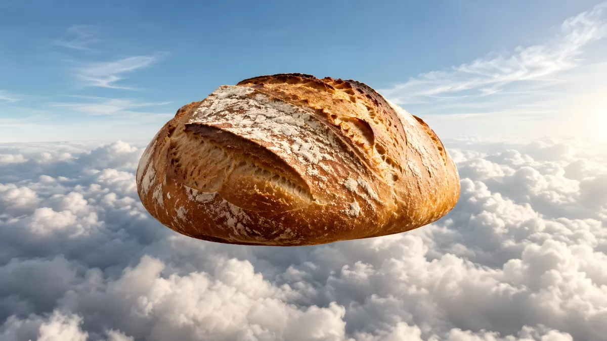 Rustikales Sauerteigbrot schwebt über den Wolken