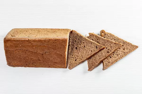 Rye bread triangular shape on white background (Flip 2019)