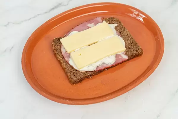 Rye Bread with Pork Neck and Cheese on the plate