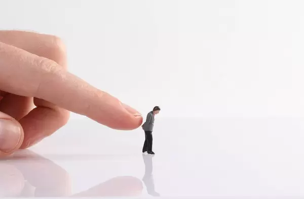 Sad businessman needs a push to go forward