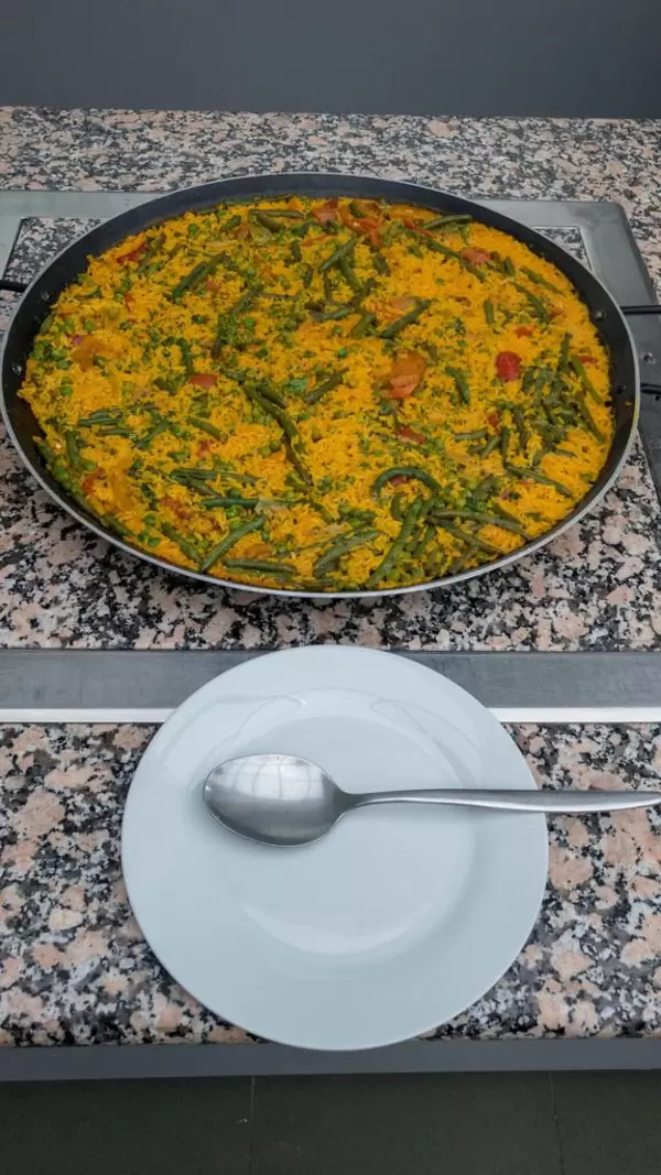 Saffron risotto with carrots, green bean and peas