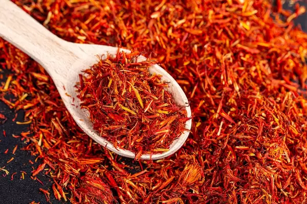 Saffron spice in a wooden spoon