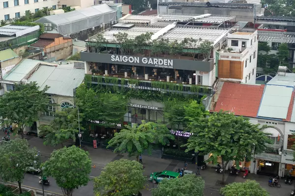 Saigon Garden Building with Starbucks Coffee and other Shops and Cafes at Nguyen Hue Walking Street in Ho Chi Minh City, Vietnam