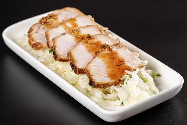 Salad with fresh cabbage with pieces of baked meat