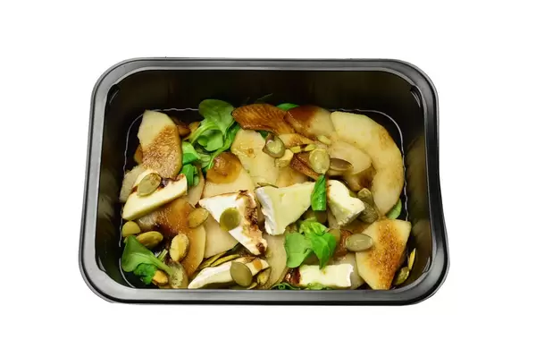 Salad with pear, camembert cheese and pumpkin seeds