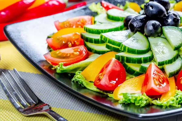 Salad with tomato pepper and cucumber, food close up  Flip 2019
