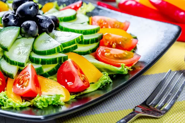 Salad with tomato pepper and cucumber, food close up