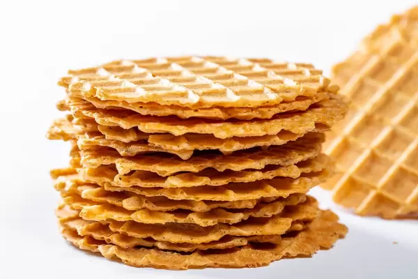 Salted tomato and Basil waffle snacks on white background